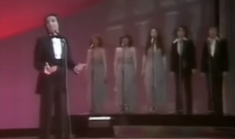 Joël Prévost with three female and two male backing singers